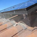 Close up shot of a residential solar panel screening that we did, should provide them with Bird-Free results.
